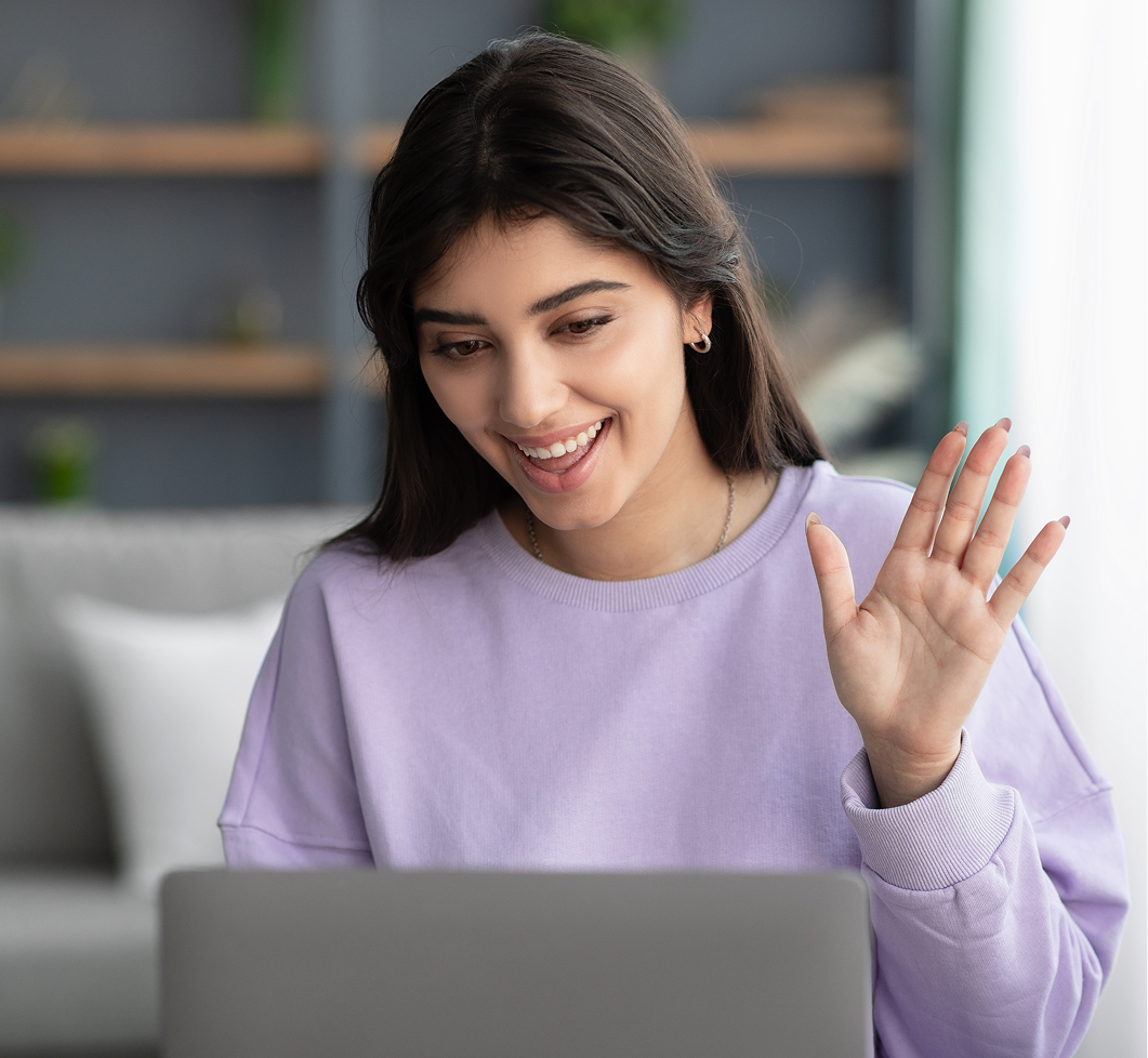 Woman waving during a video call – online psychiatry in Sterling Heights, MI
